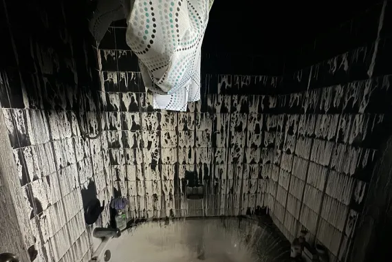 Room walls and ceiling covered in soot