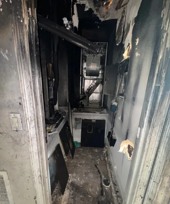 Soot and smoke damage on walls and ceiling after fire